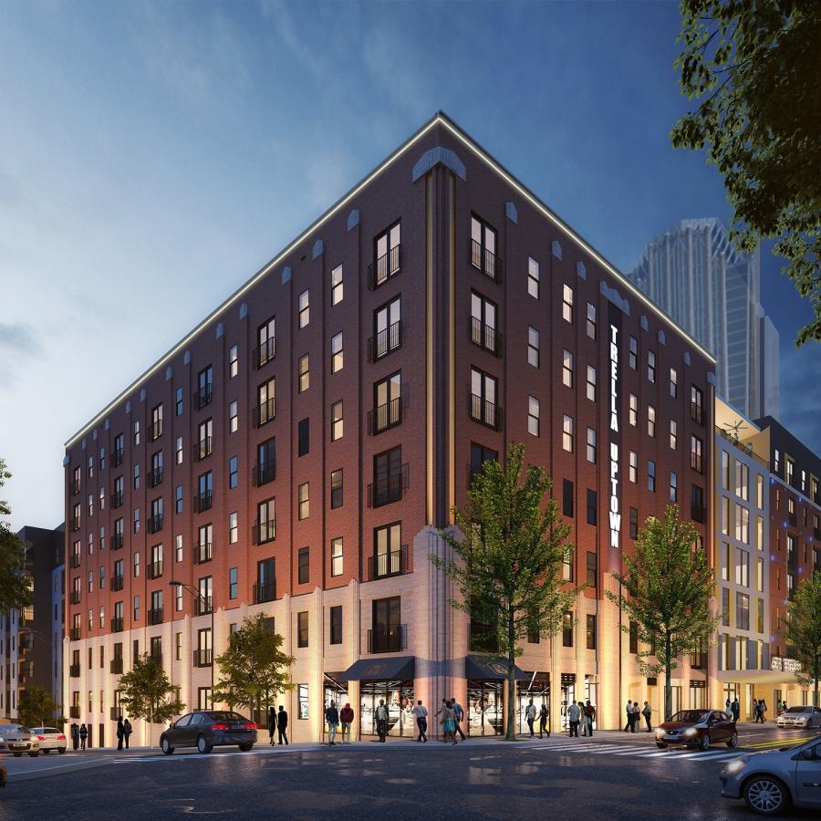 Settle into comfort at Trella Uptown a large building with many windows