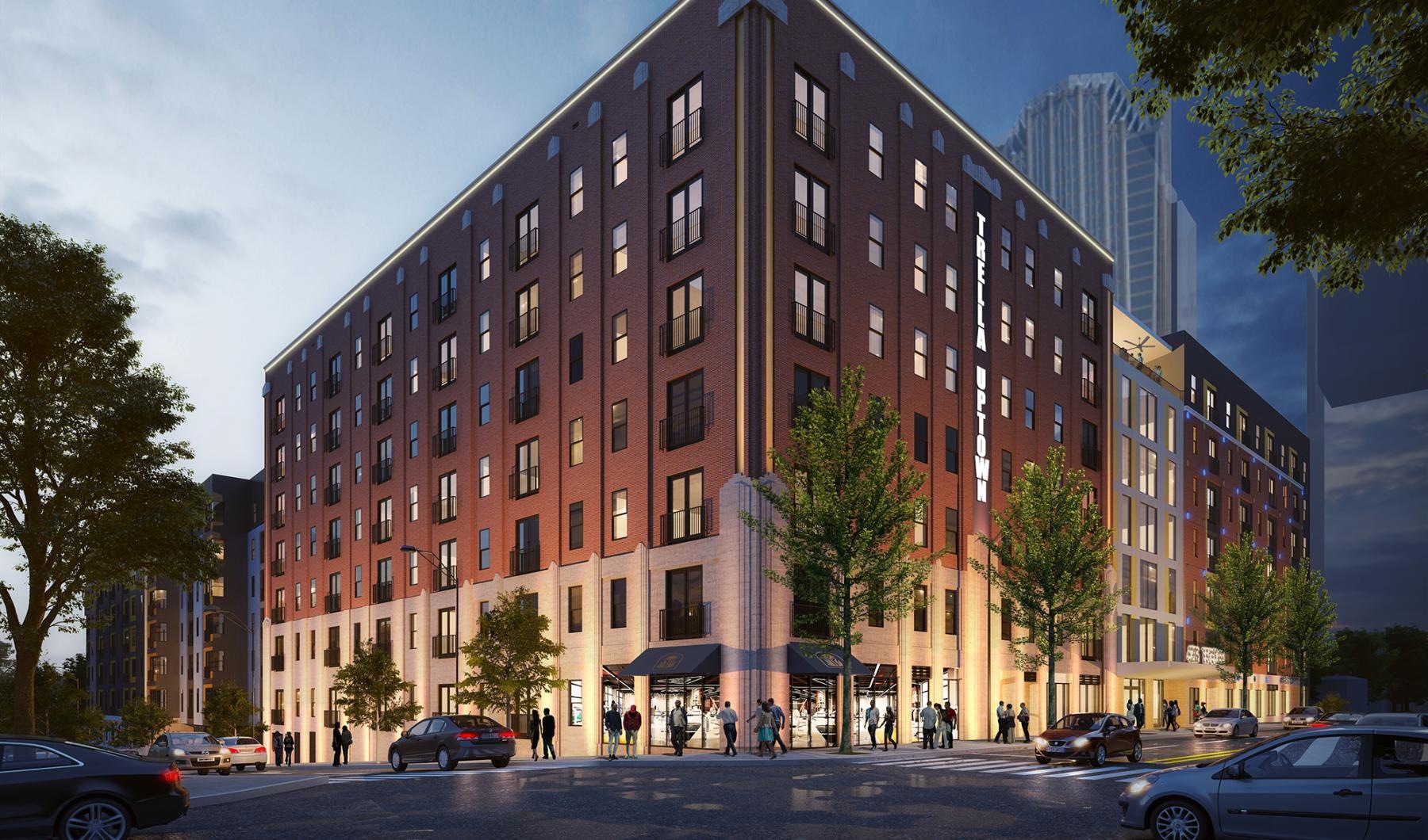 Settle into comfort at Trella Uptown a large building with many windows