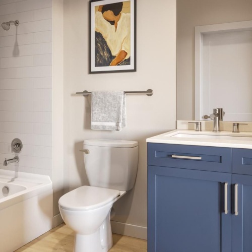 a bathroom with a tub, toilet and sink